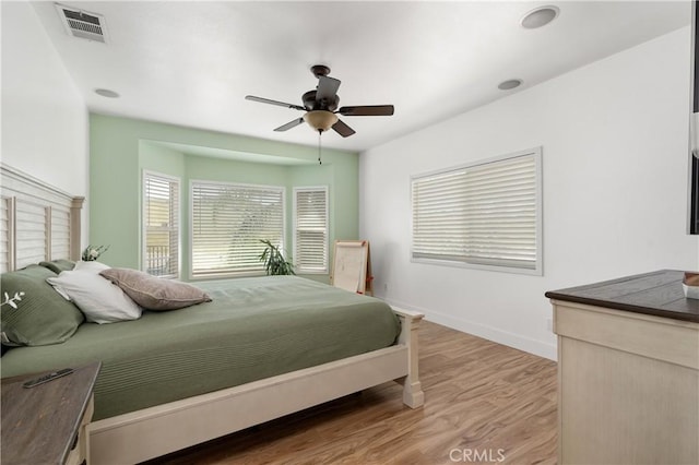 14445 Dove Canyon Dr, Riverside, CA 92503 - bedroom with light wood finished floors, a ceiling fan, and baseboards