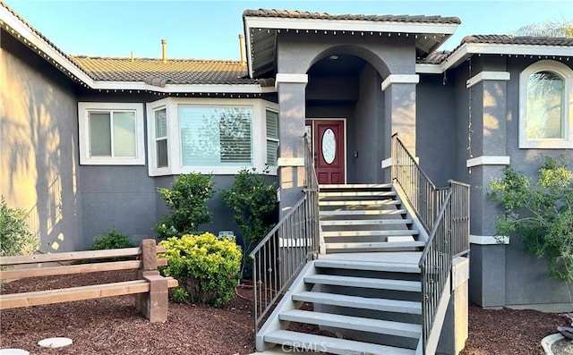14445 Dove Canyon Dr, Riverside, CA 92503 - doorway to property featuring stucco siding and a tiled roof