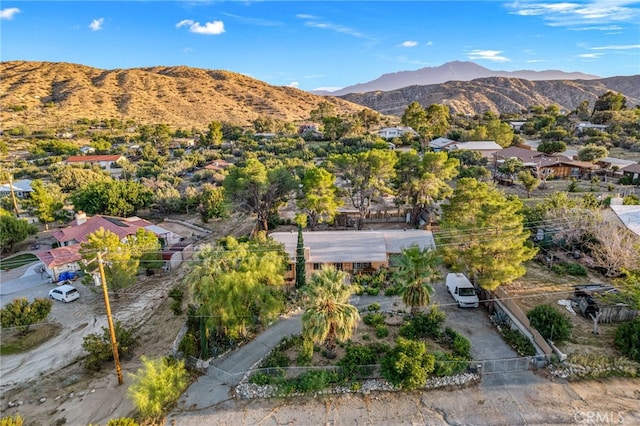 birds eye view of property with a mountain view