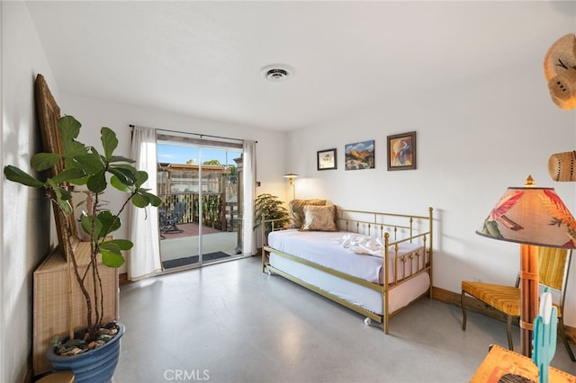 bedroom featuring baseboards, finished concrete flooring, access to exterior, and visible vents