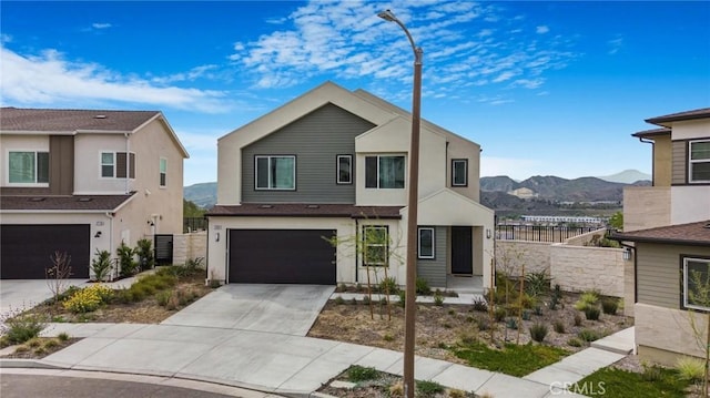 27824 Marquee Dr, Valencia, CA 91381 - view of front of property featuring a mountain view, concrete driveway, and an attached garage