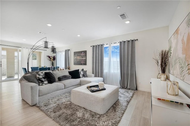 27824 Marquee Dr, Valencia, CA 91381 - living area with healthy amount of natural light, light wood-type flooring, and recessed lighting