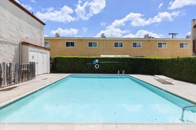 888 Cherrywood Way Unit 20, El Cajon, CA 92021 - pool featuring an outbuilding, fence, a shed, and a patio area