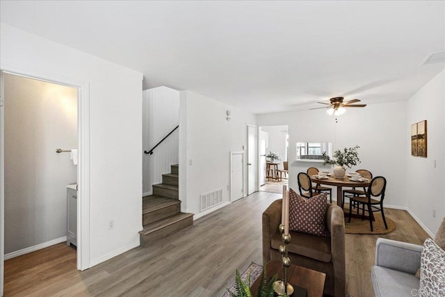 888 Cherrywood Way Unit 20, El Cajon, CA 92021 - living room with a ceiling fan, wood finished floors, stairway, and visible vents