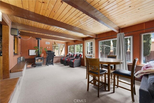 4228 Willow Trl, Frazier Park, CA 93225 - carpeted dining room with wood ceiling, visible vents, a wood stove, and beamed ceiling