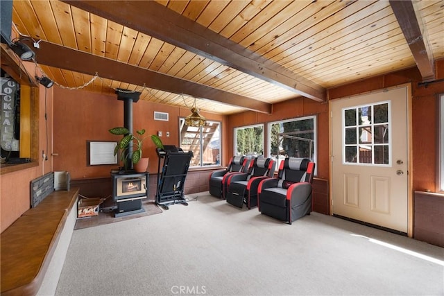 4228 Willow Trl, Frazier Park, CA 93225 - interior space featuring wooden ceiling, carpet floors, beam ceiling, a wood stove, and visible vents