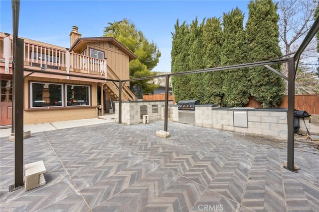 4228 Willow Trl, Frazier Park, CA 93225 - view of patio featuring fence, a wooden deck, area for grilling, stairway, and a grill