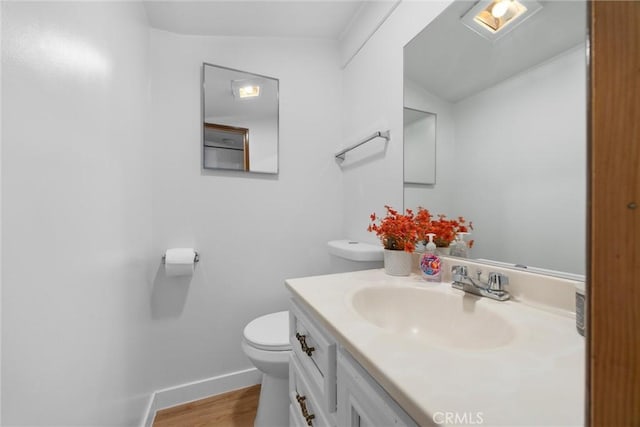 4228 Willow Trl, Frazier Park, CA 93225 - half bathroom featuring baseboards, wood finished floors, toilet, and vanity