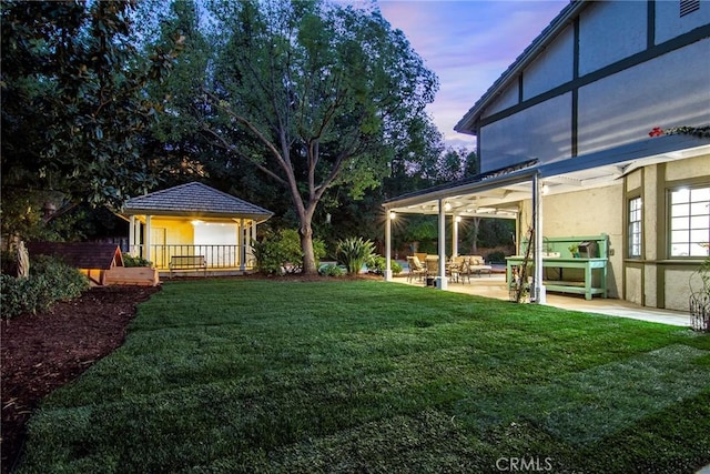 29528 Ridgeway Dr, Agoura Hills, CA 91301 - yard at dusk with a patio area and a yard