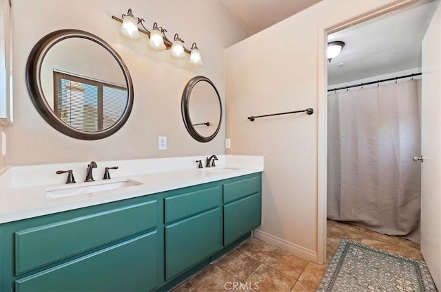 2583 W Fairview Dr, Rialto, CA 92377 - full bathroom with a sink, baseboards, and double vanity