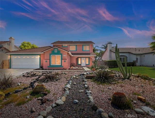 2583 W Fairview Dr, Rialto, CA 92377 - view of front facade with a tiled roof, a garage, stucco siding, and concrete driveway