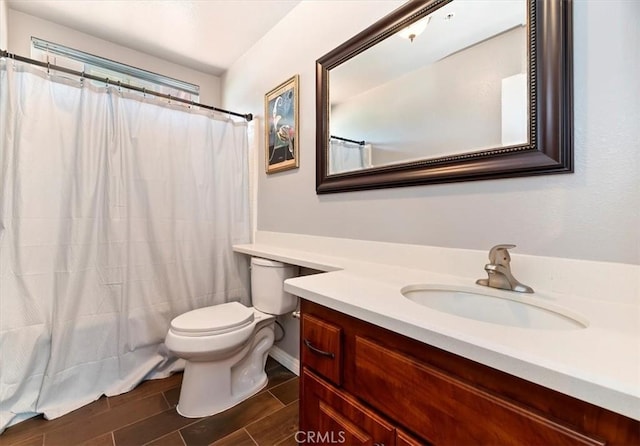 2583 W Fairview Dr, Rialto, CA 92377 - full bath featuring toilet, vanity, wood finish floors, and a shower with curtain