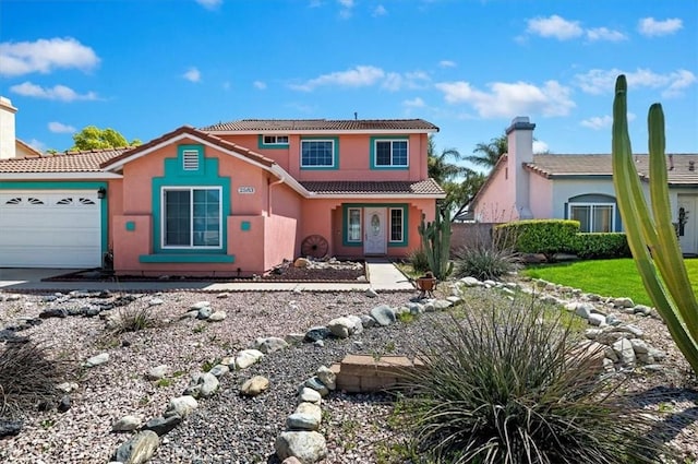 2583 W Fairview Dr, Rialto, CA 92377 - view of front of home with stucco siding, a chimney, an attached garage, and a tile roof