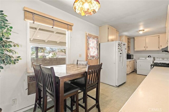 dining space with washing machine and dryer