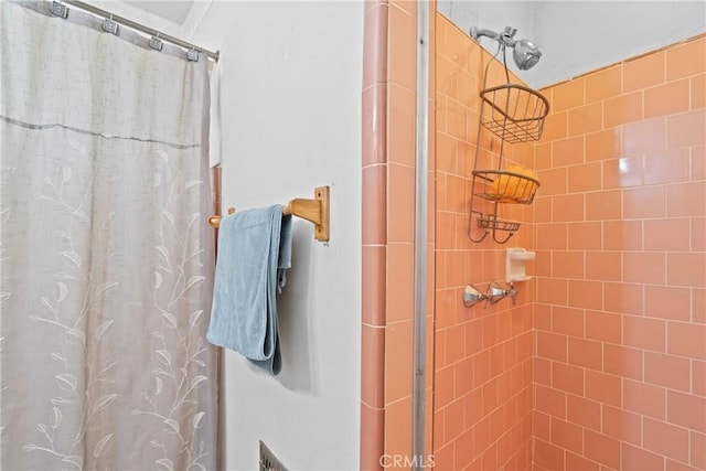 bathroom with a stall shower