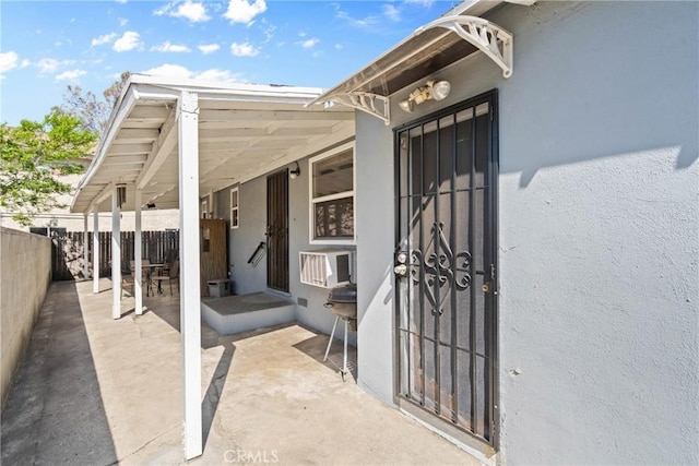 300 Palisade St, Pasadena, CA 91103 - view of exterior entry with stucco siding and a patio area