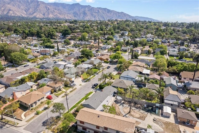 drone / aerial view featuring a residential view and a mountain view