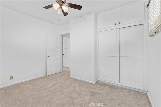 300 Palisade St, Pasadena, CA 91103 - unfurnished bedroom featuring light carpet, a closet, and a ceiling fan
