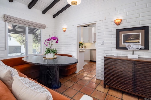 dining area with wooden ceiling, lofted ceiling with beams, and light tile patterned flooring