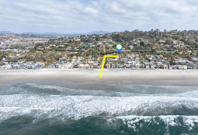 birds eye view of property featuring a residential view, a view of the beach, and a water and mountain view