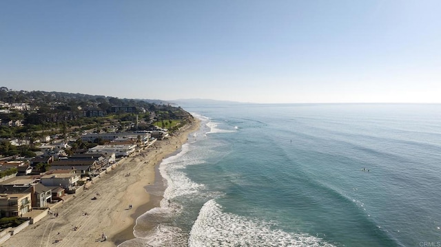 aerial view featuring a view of the beach and a water view