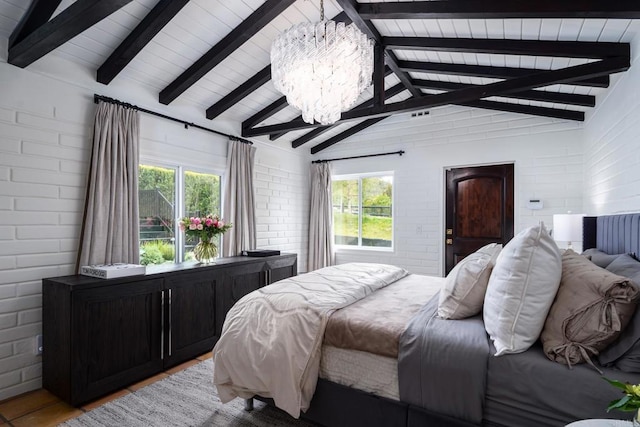bedroom featuring light wood finished floors, a notable chandelier, vaulted ceiling with beams, and multiple windows