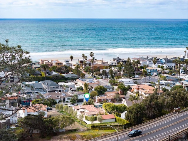 birds eye view of property with a residential view, a view of the beach, and a water view