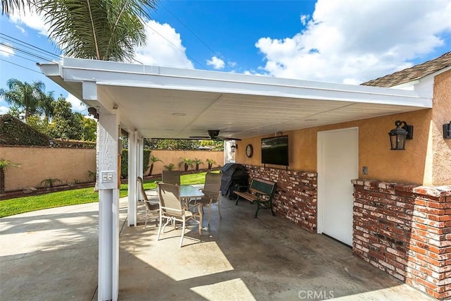 view of patio / terrace featuring fence and outdoor dining area