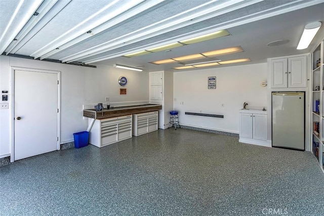 garage with freestanding refrigerator