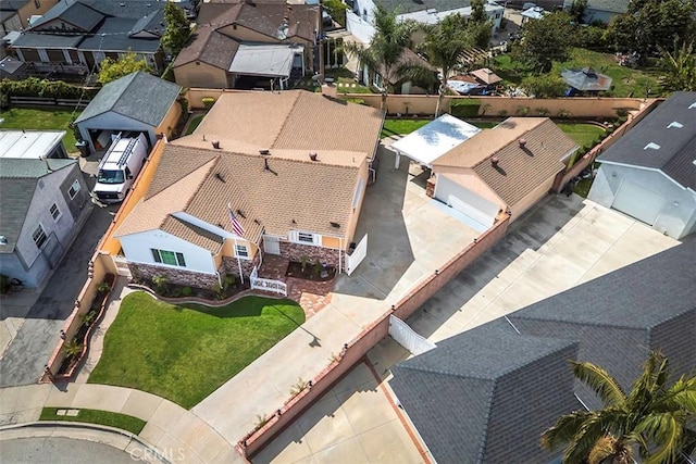 birds eye view of property with a residential view