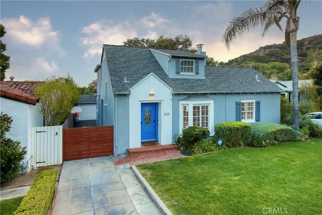 1628 Santa Rosa Ave, Glendale, CA 91208 - view of front facade with stucco siding, roof with shingles, a front yard, a gate, and a chimney