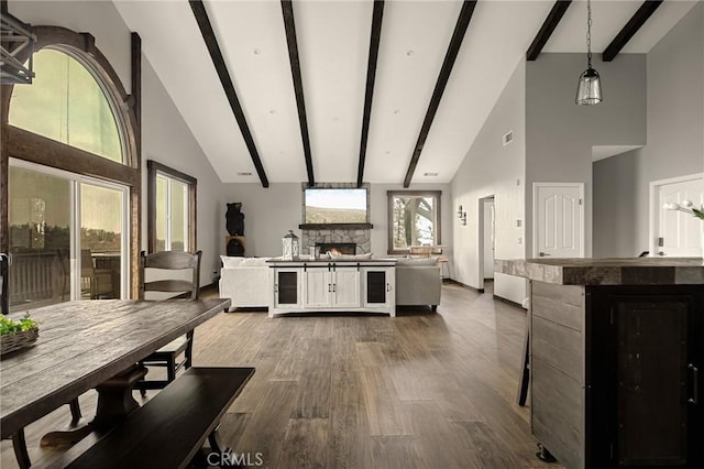 1207 Grass Valley Rd, Lake Arrowhead, CA 92352 - kitchen with high vaulted ceiling, open floor plan, a fireplace, dark wood-type flooring, and beamed ceiling