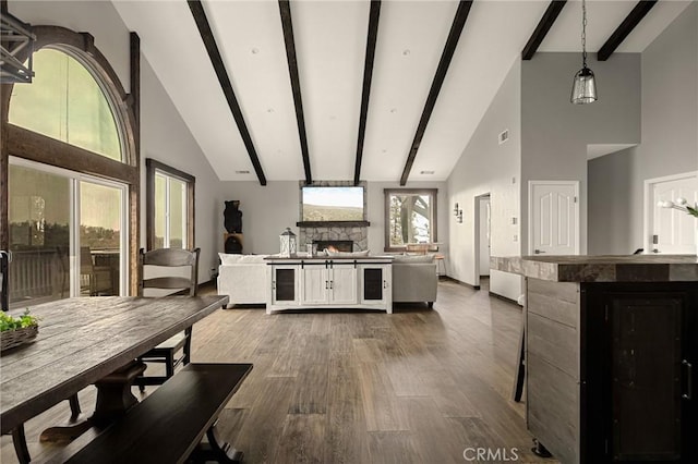 1207 Grass Valley Rd, Lake Arrowhead, CA 92352 - living area with high vaulted ceiling, a fireplace, dark wood finished floors, and beamed ceiling