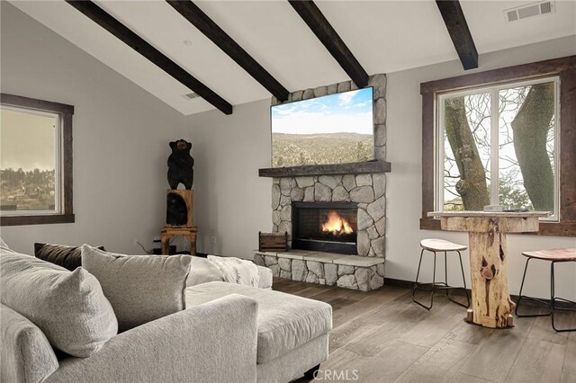 1207 Grass Valley Rd, Lake Arrowhead, CA 92352 - living room featuring wood finished floors, a fireplace, plenty of natural light, and baseboards