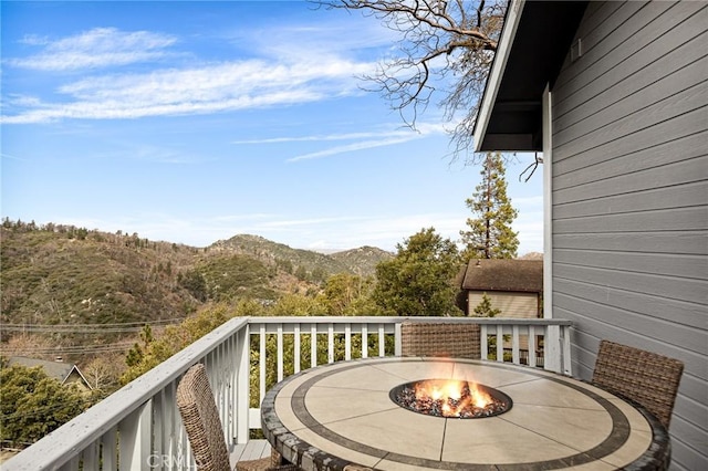 1207 Grass Valley Rd, Lake Arrowhead, CA 92352 - balcony with a mountain view and an outdoor fire pit