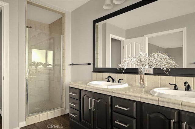 1207 Grass Valley Rd, Lake Arrowhead, CA 92352 - full bathroom with double vanity, a stall shower, wood finished floors, and backsplash