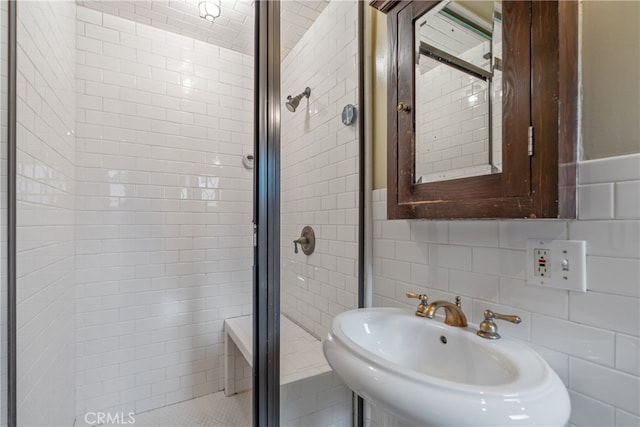 2280 W 24th St, Los Angeles, CA 90018 - bathroom with a sink, tasteful backsplash, tile walls, and a shower stall