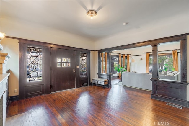 2280 W 24th St, Los Angeles, CA 90018 - entryway featuring a fireplace, visible vents, and hardwood / wood-style flooring