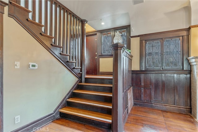 2280 W 24th St, Los Angeles, CA 90018 - stairway with recessed lighting, baseboards, and wood finished floors