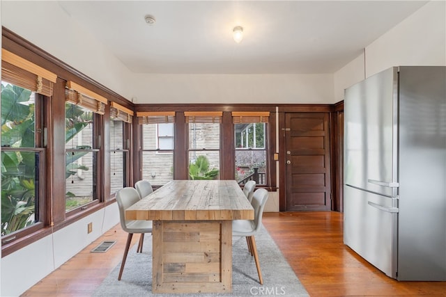 2280 W 24th St, Los Angeles, CA 90018 - dining space featuring a wealth of natural light, visible vents, and light wood-style floors