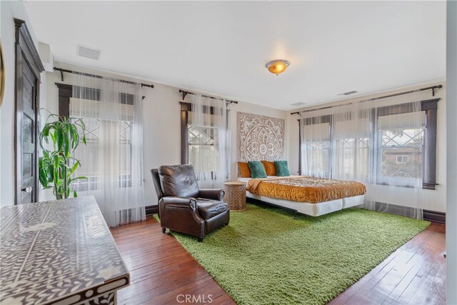2280 W 24th St, Los Angeles, CA 90018 - bedroom featuring visible vents and hardwood / wood-style flooring
