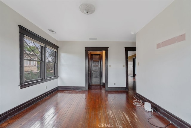 2280 W 24th St, Los Angeles, CA 90018 - spare room featuring baseboards, visible vents, and hardwood / wood-style flooring