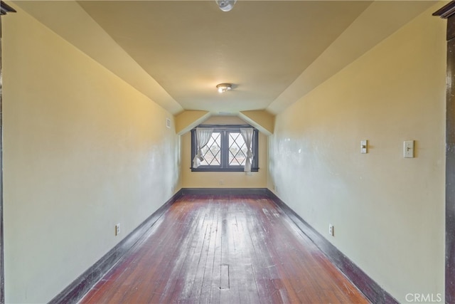 2280 W 24th St, Los Angeles, CA 90018 - additional living space featuring baseboards, dark wood-style floors, and vaulted ceiling