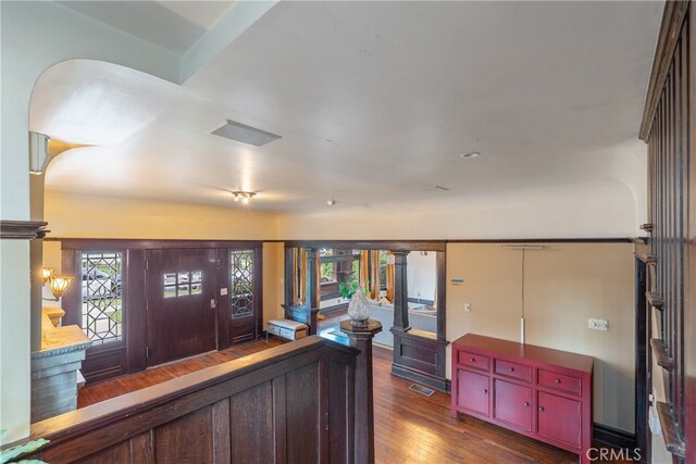 2280 W 24th St, Los Angeles, CA 90018 - entrance foyer featuring plenty of natural light, visible vents, wood finished floors, and ornate columns