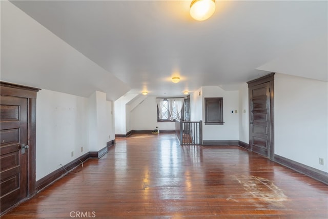 2280 W 24th St, Los Angeles, CA 90018 - additional living space featuring dark wood-type flooring, baseboards, and lofted ceiling