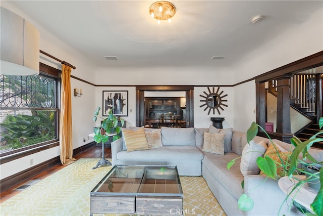 2280 W 24th St, Los Angeles, CA 90018 - living area with baseboards, stairs, visible vents, and wood finished floors