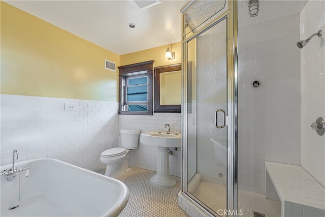 2280 W 24th St, Los Angeles, CA 90018 - full bath with tile patterned floors, a stall shower, tile walls, and visible vents
