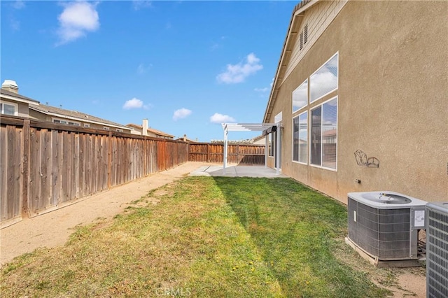 13204 Monrovia St, Hesperia, CA 92344 - view of yard featuring central AC unit, a fenced backyard, and a patio area