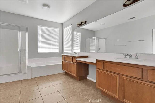 13204 Monrovia St, Hesperia, CA 92344 - full bathroom with a bath, a sink, a shower stall, and visible vents