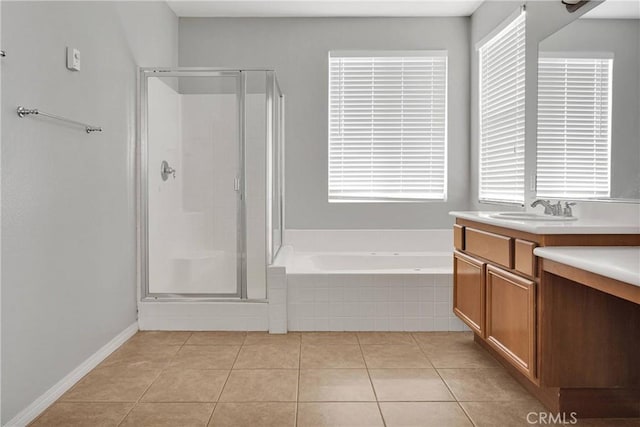 13204 Monrovia St, Hesperia, CA 92344 - bathroom featuring a garden tub, a stall shower, tile patterned flooring, and vanity